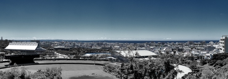 a panoramic view of the city of Urasoe on sunny day