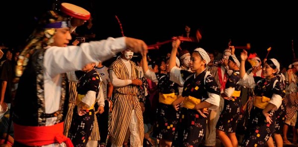 a drummer and female dancers perform Eisa